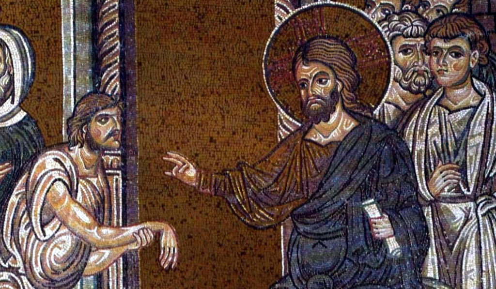Mosaico bizantino en la Catedral de Monreale representando a Cristo curando a un hombre con la mano paralizada.